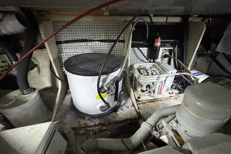 Slide: The Image of Engine room of 1994 President 445 Sundeck yacht with mechanical equipment and wiring. - 148
