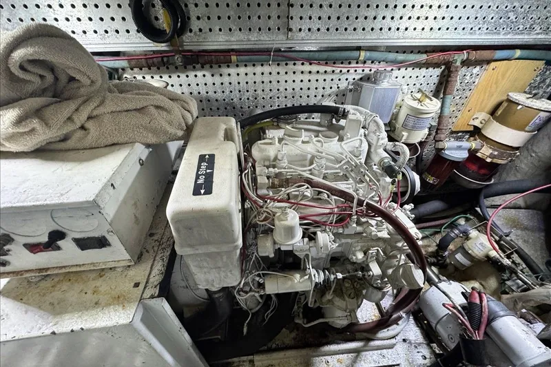 Slide: The Image of Engine room of 1994 President 445 Sundeck yacht with visible machinery and components. - 149