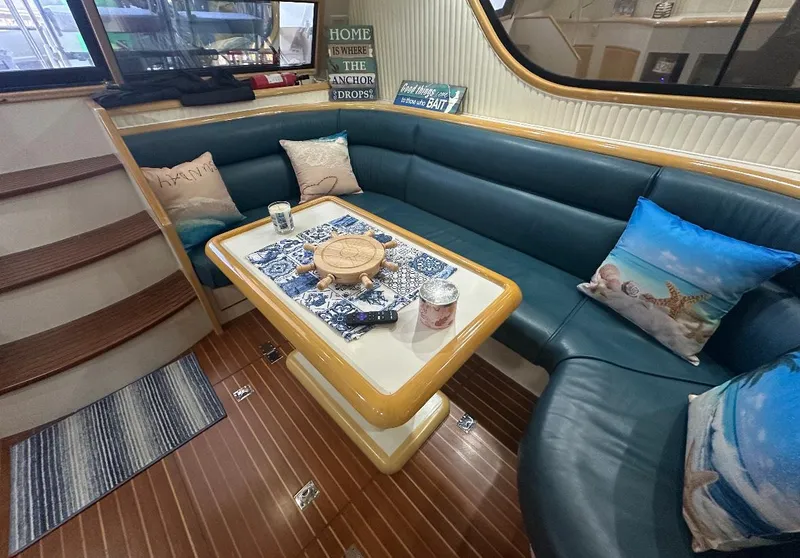 Slide: The Image of 1994 President 445 Sundeck yacht docked at marina with American flag. - 17