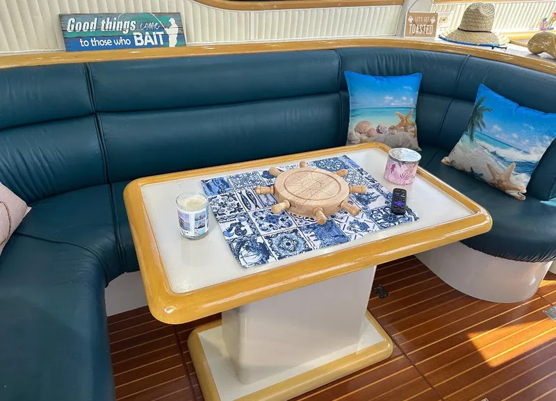 Slide: The Image of 1994 President 445 Sundeck yacht docked at marina with palm trees and clear sky. - 18