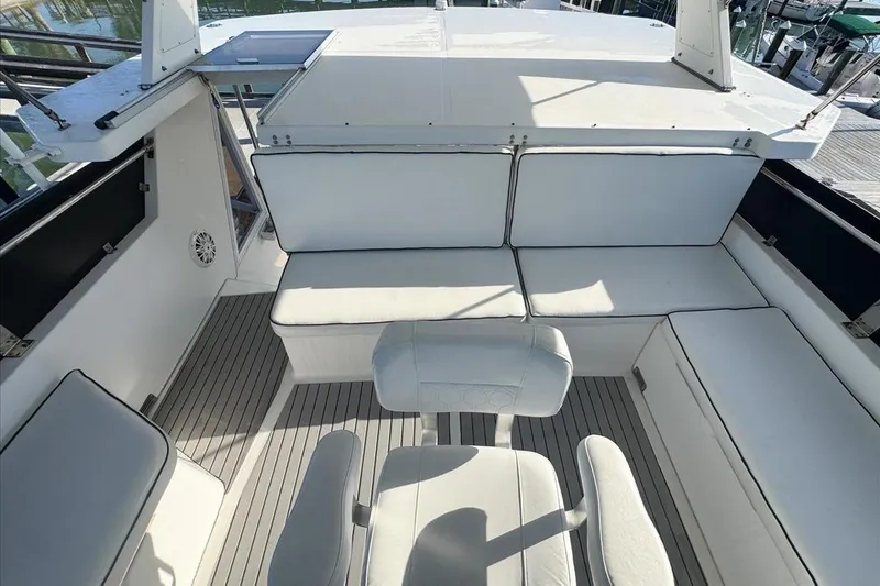 Slide: The Image of 1994 President 445 Sundeck yacht interior with white seating and sleek design. - 34