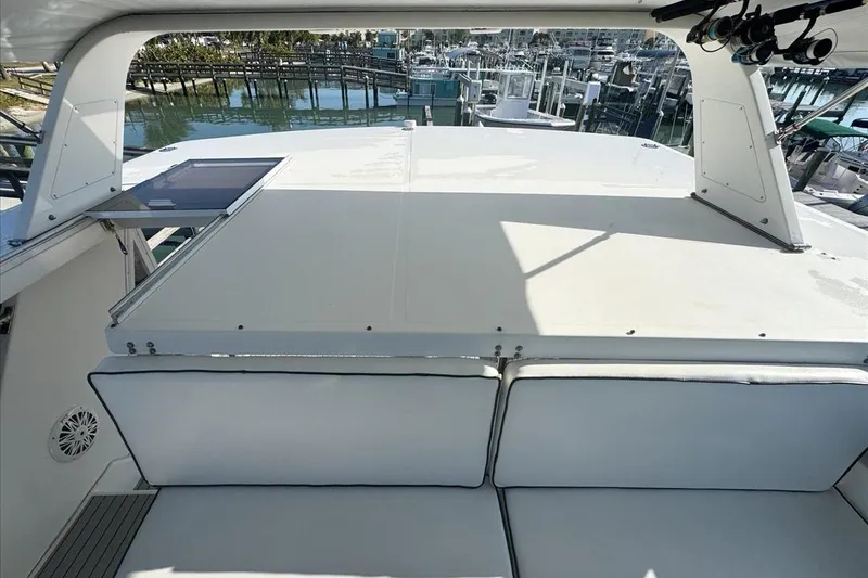 Slide: The Image of 1994 President 445 Sundeck yacht with spacious deck and marina view. - 45