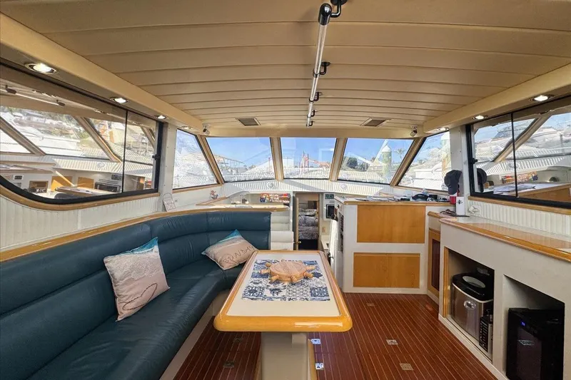 Slide: The Image of Luxurious interior of a 1994 President 445 Sundeck yacht with elegant seating and decor. - 59