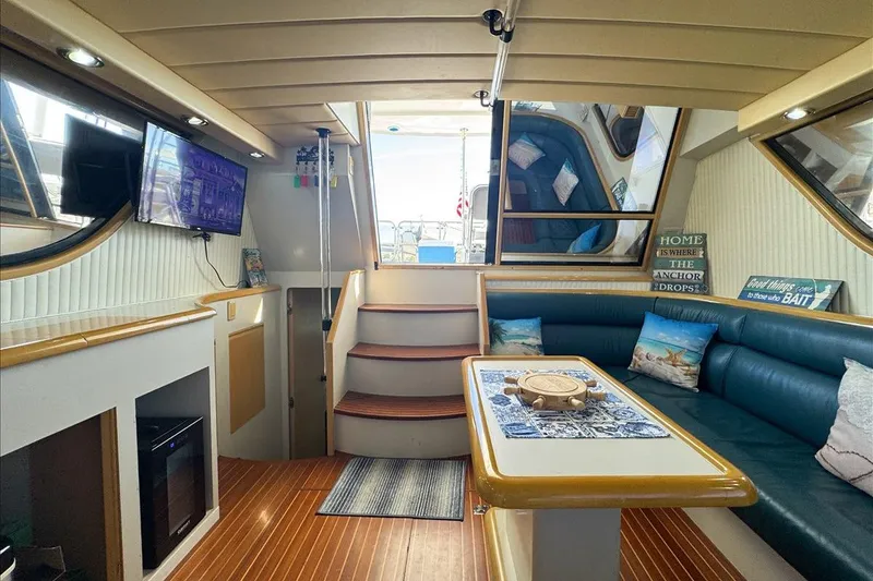 Slide: The Image of Luxurious interior of a 1994 President 445 Sundeck yacht with cozy seating and modern amenities. - 62