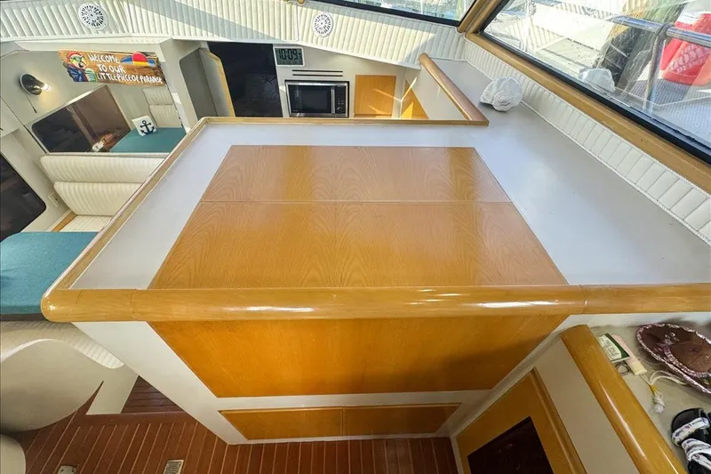 Slide: The Image of 1994 President 445 Sundeck interior with wood accents and cozy seating area. - 65