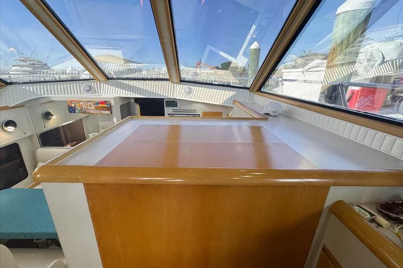 Slide: The Image of Interior of 1994 President 445 Sundeck yacht with wooden finishes and large windows. - 67