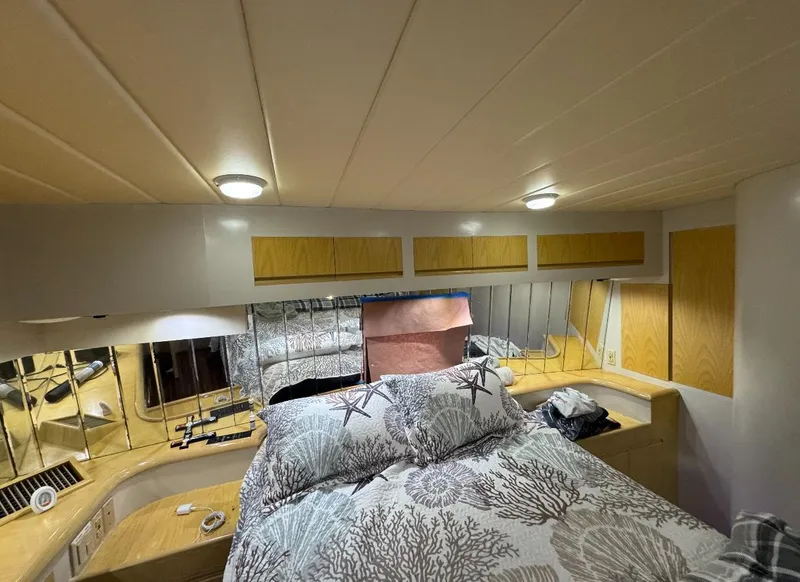 Slide: The Image of 1994 President 445 Sundeck yacht docked in a sunny marina setting. - 7