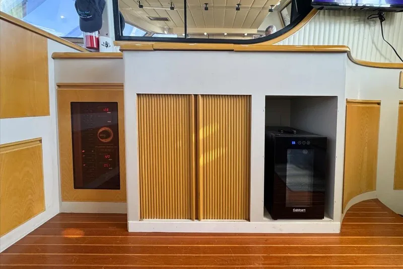 Slide: The Image of 1994 President 445 Sundeck interior with wooden cabinetry and modern appliances. - 72