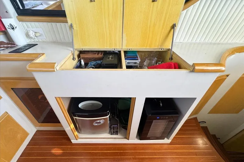 Slide: The Image of Cabinet storage on 1994 President 445 Sundeck yacht with appliances and accessories. - 74