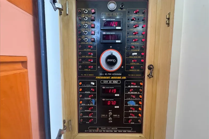 Slide: The Image of Electrical control panel on a 1994 President 445 Sundeck boat. - 75
