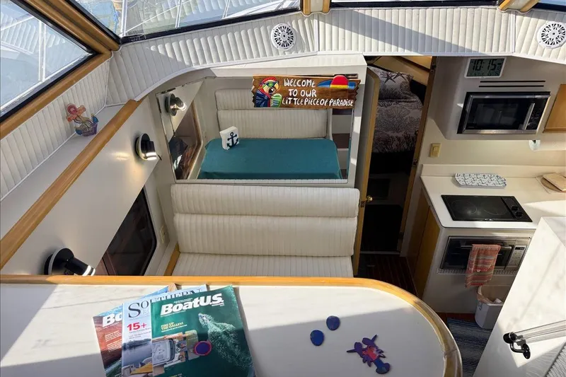 Slide: The Image of Interior of 1994 President 445 Sundeck yacht with cozy seating and kitchen area. - 79
