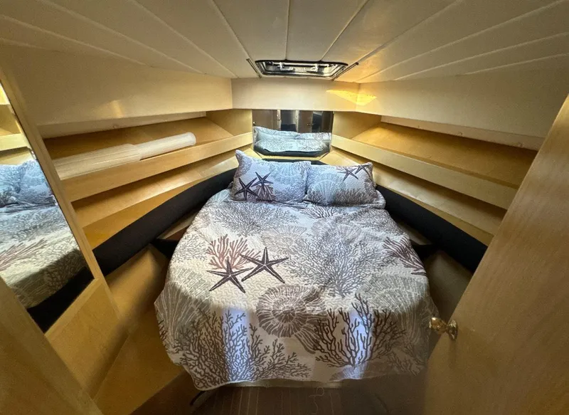 Slide: The Image of Aerial view of a 1994 President 445 Sundeck yacht docked at a marina. - 8