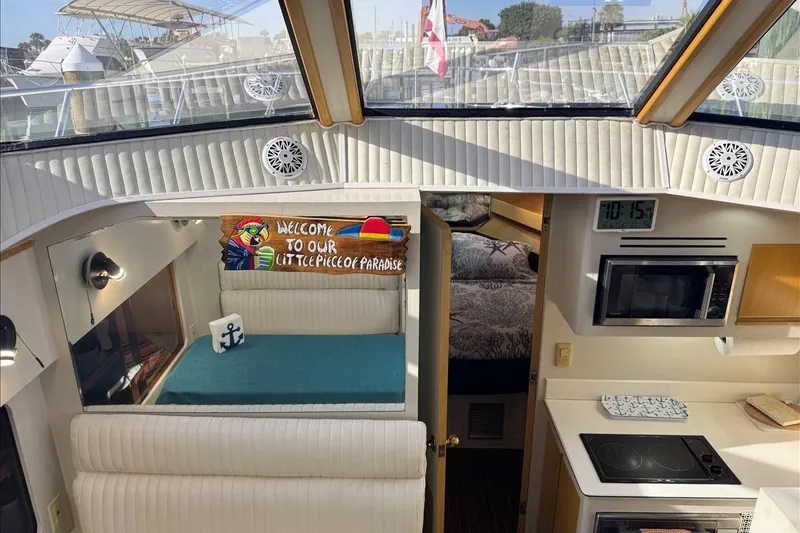 Slide: The Image of Interior of 1994 President 445 Sundeck yacht with cozy seating and kitchen area. - 80
