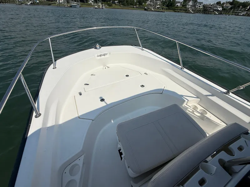 Slide: The Image of 2022 Boston Whaler 170 Montauk boat deck on calm water. - 16