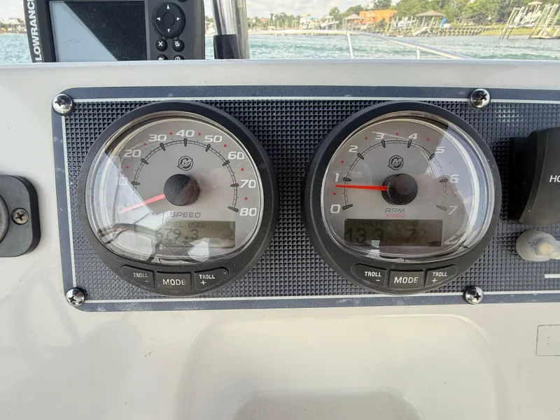 Slide: The Image of Dashboard of a 2022 Boston Whaler 170 Montauk boat showing speed and RPM gauges. - 18