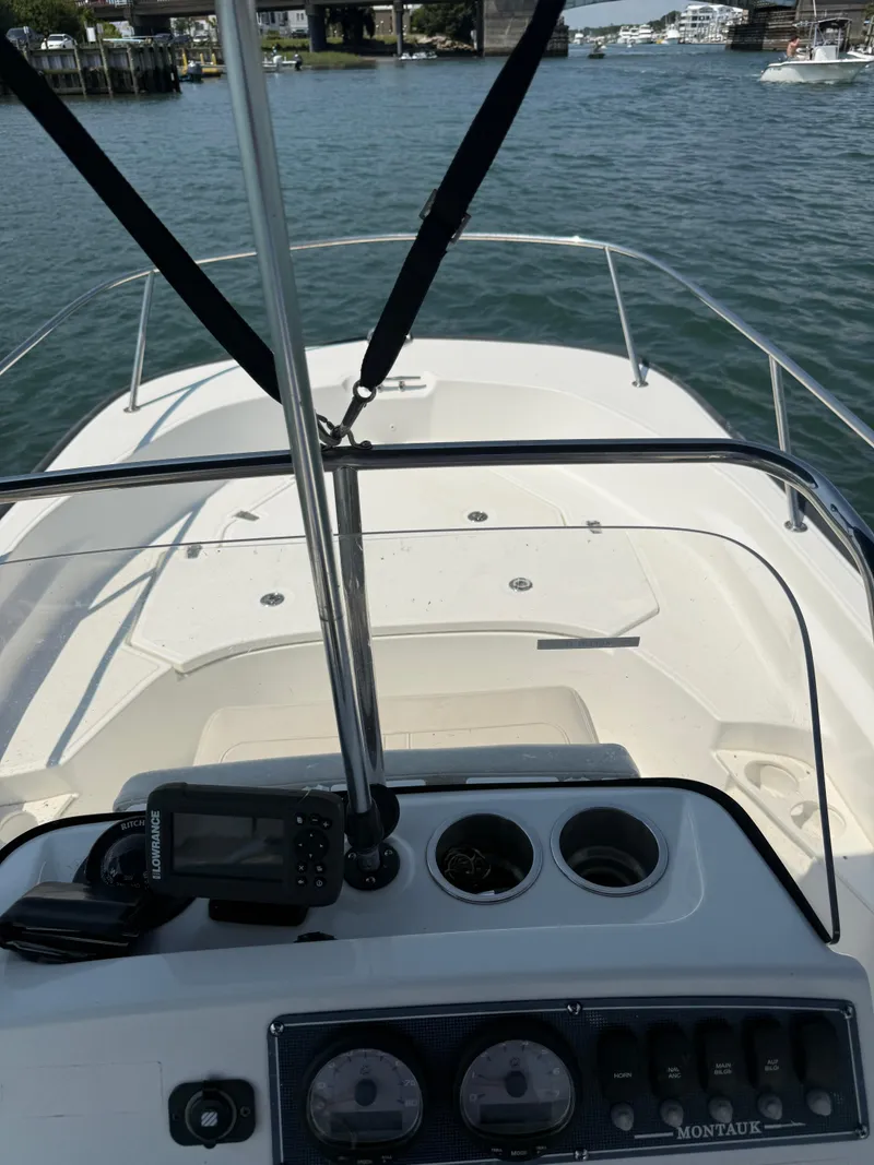 Slide: The Image of 2022 Boston Whaler 170 Montauk boat dashboard with water view. - 29