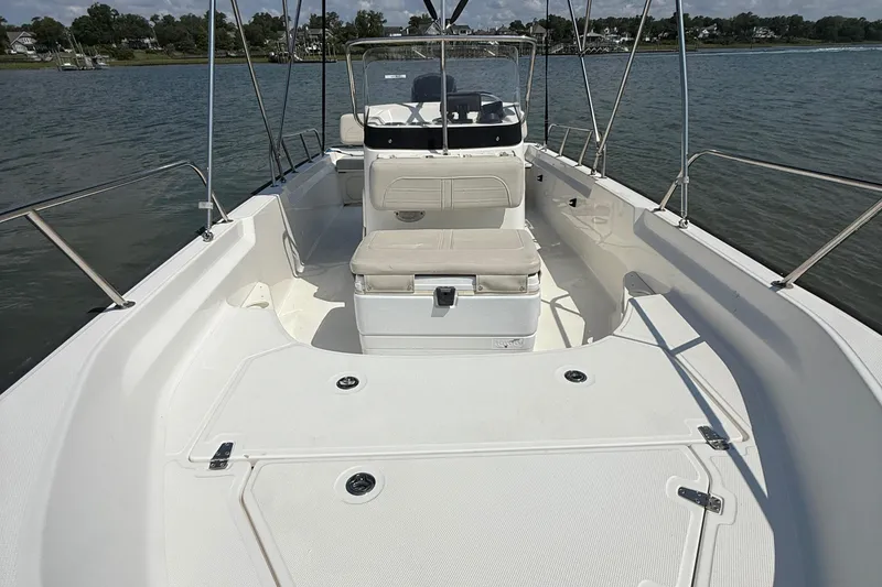 Slide: The Image of 2022 Boston Whaler 170 Montauk boat interior on calm water. - 30