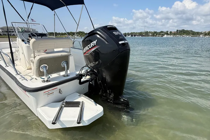 Slide: The Image of 2022 Boston Whaler 170 Montauk boat with Mercury engine in shallow water. - 5