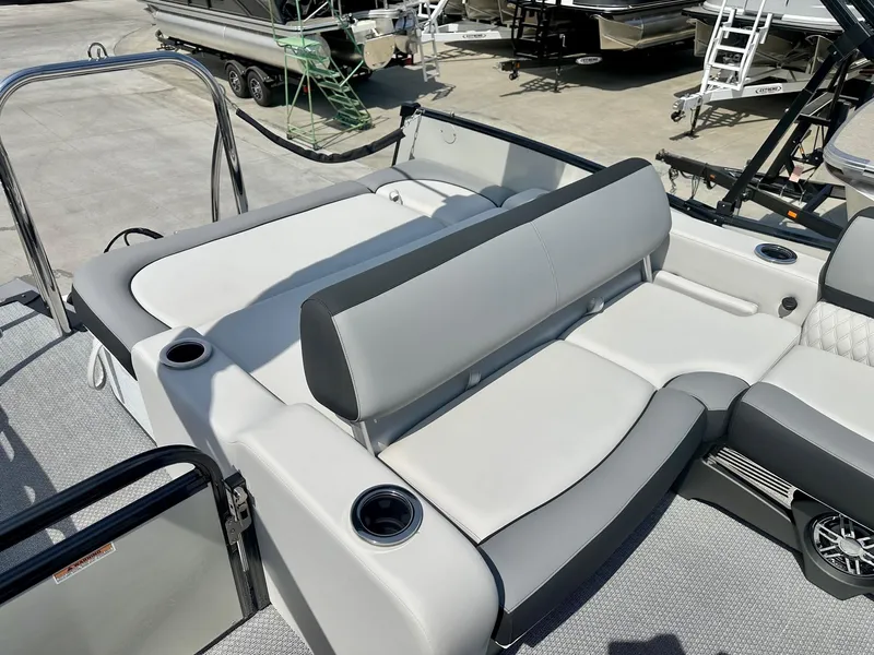 Slide: The Image of 2025 Avalon Catalina boat with versatile rear bench seating, featuring sleek design and cup holders. - 11