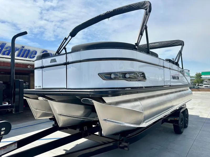 Slide: The Image of 2025 Avalon Catalina 23 FT pontoon boat with versatile rear bench and 200HP Mercury engine. - 2