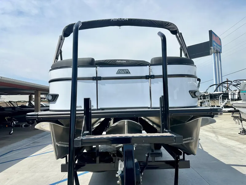 Slide: The Image of 2025 Avalon Catalina boat, 23 ft, versatile rear bench, 200HP Mercury engine, displayed outdoors. - 3