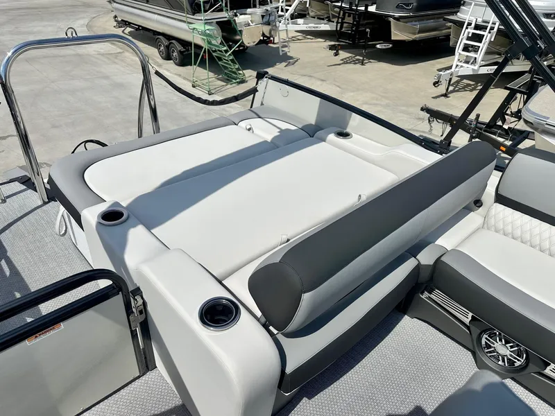 Slide: The Image of 2025 Avalon Catalina boat with versatile rear bench, featuring sleek design and cup holders. - 7