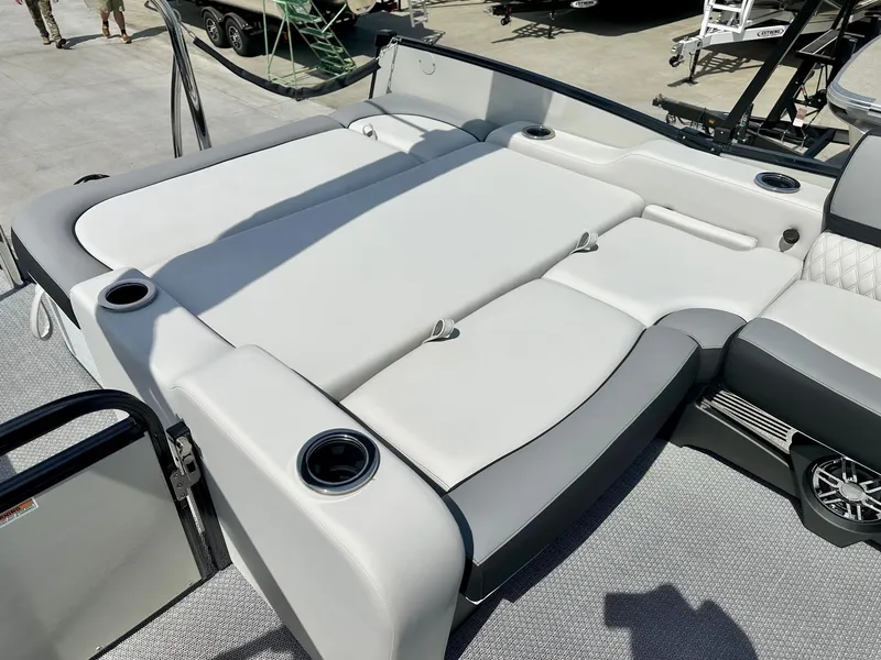Slide: The Image of 2025 Avalon Catalina boat with versatile rear bench and cup holders, featuring luxurious seating. - 8