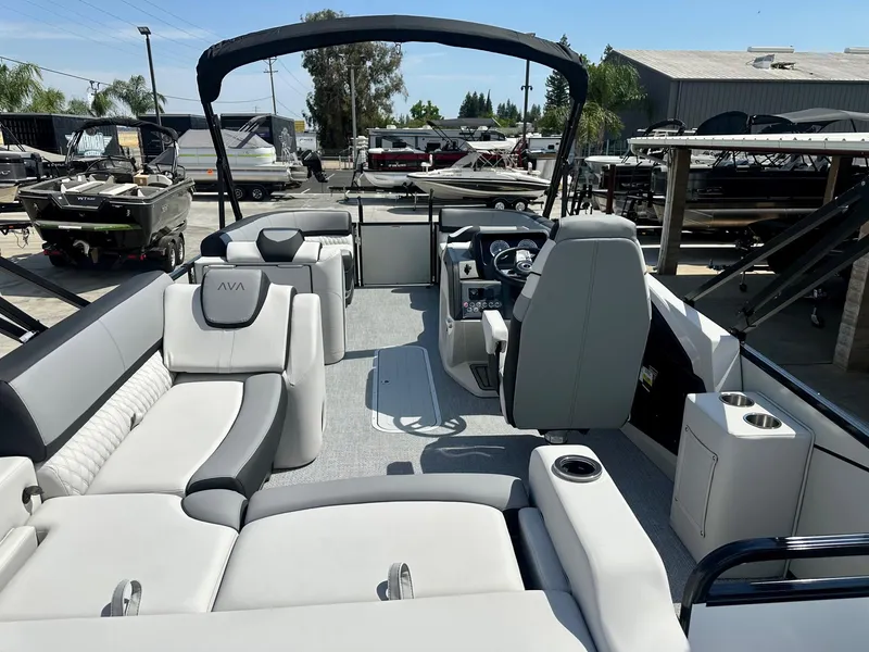 Slide: The Image of 2025 Avalon Catalina boat with versatile rear bench, 200HP Mercury engine, sleek interior design. - 9