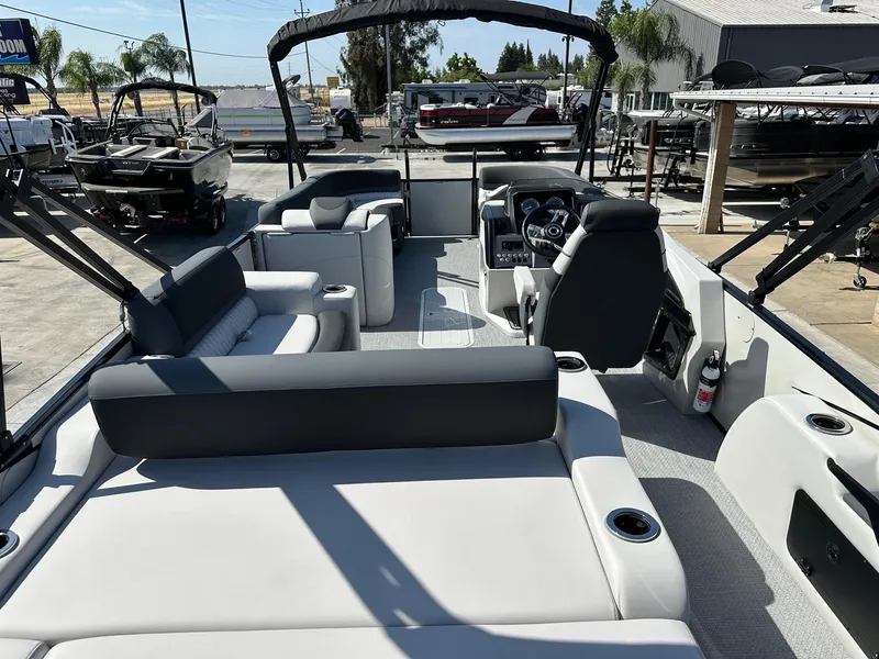 Slide: The Image of 2025 Avalon Catalina boat with versatile rear lounger, 250HP Mercury Verado, docked outdoors. - 10
