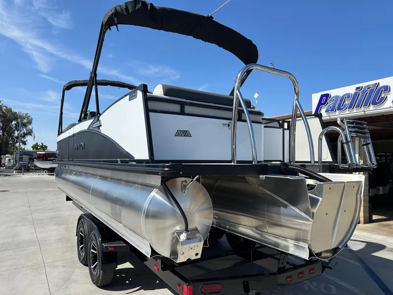 Slide: The Image of 2025 Avalon Catalina 25 FT Versatile Rear Lounger with 250HP Mercury Verado, parked outdoors. - 12