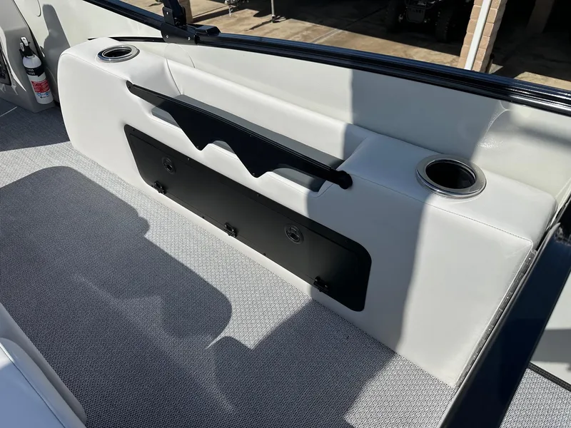 Slide: The Image of 2025 Avalon Catalina boat interior with cup holders and storage compartment. - 15