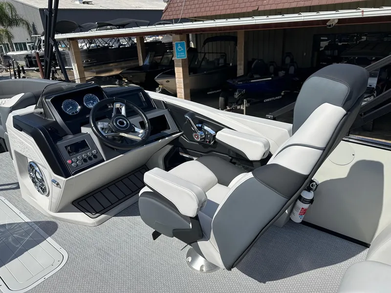 Slide: The Image of 2025 Avalon Catalina boat helm with modern controls and comfortable seating. - 16