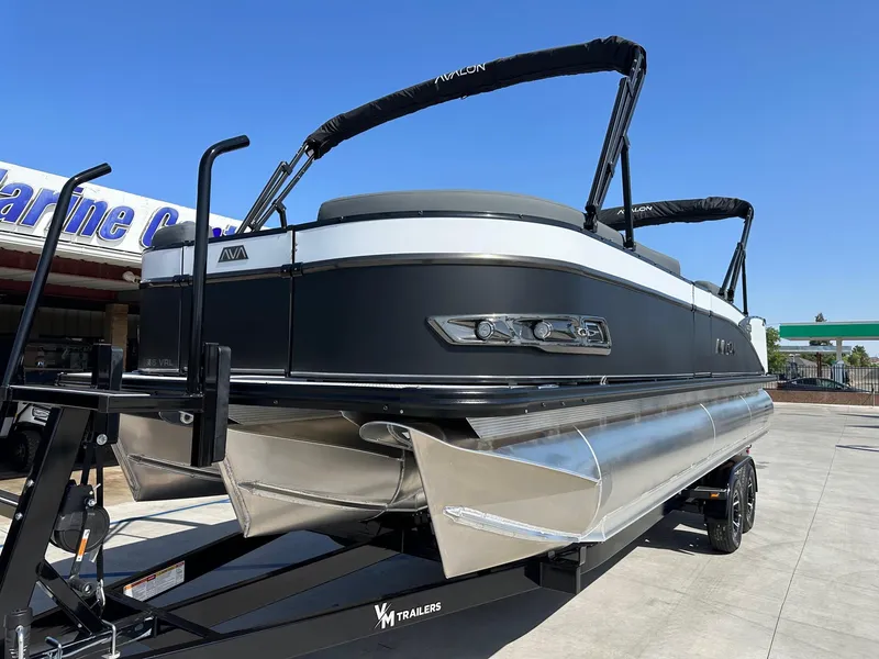 Slide: The Image of 2025 Avalon Catalina 25 FT Versatile Rear Lounger with 250HP Mercury Verado on trailer. - 2