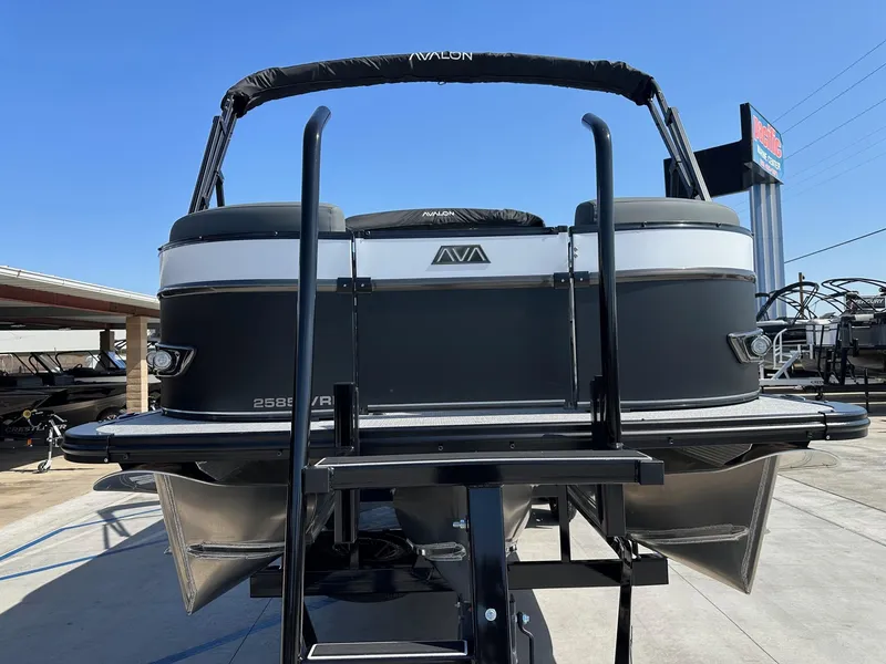 Slide: The Image of 2025 Avalon Catalina boat, 25 FT Versatile Rear Lounger, displayed on a trailer. - 3