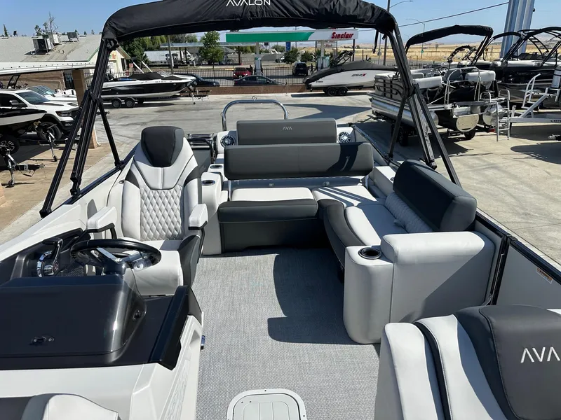 Slide: The Image of 2025 Avalon Catalina boat interior with versatile rear lounger, luxurious seating, and modern design. - 6