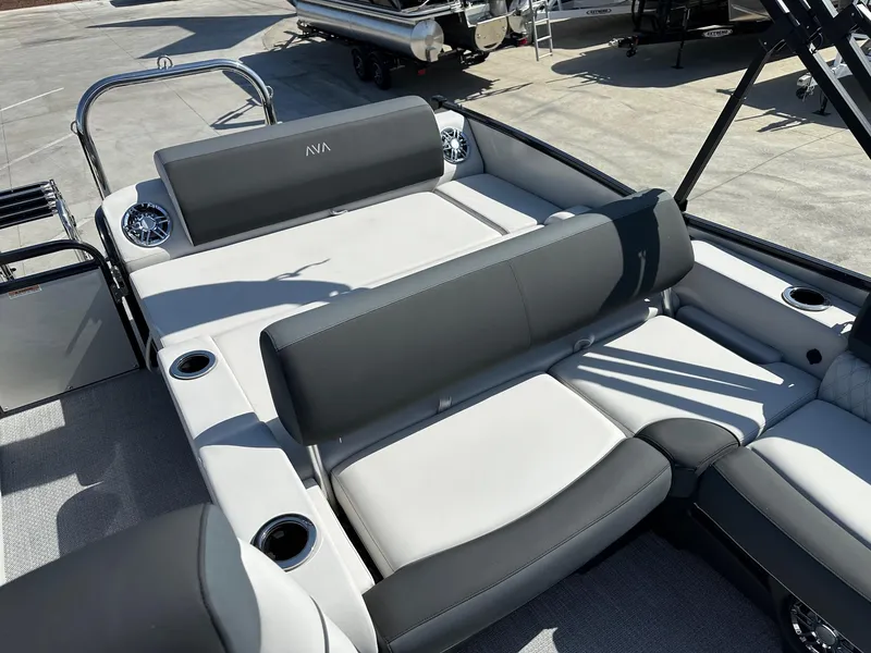 Slide: The Image of 2025 Avalon Catalina boat with versatile rear lounger, featuring luxurious seating and cup holders. - 7