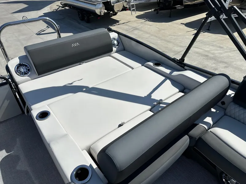 Slide: The Image of 2025 Avalon Catalina boat with versatile rear lounger, featuring luxurious seating and cup holders. - 8