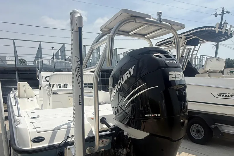 Slide: The Image of 2011 Boston Whaler 230 Dauntless with Mercury 250 Verado engine, docked outdoors. - 12