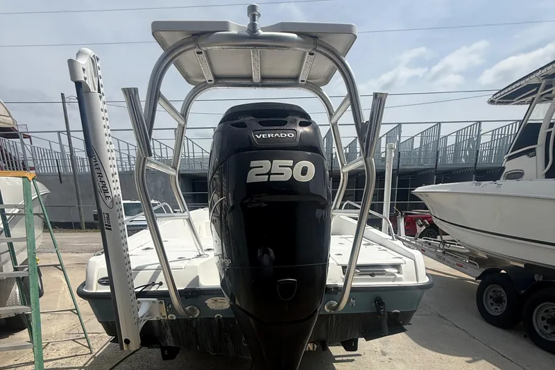Slide: The Image of 2011 Boston Whaler 230 Dauntless with 250 Verado engine, docked outdoors. - 13