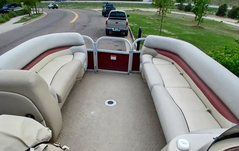 Slide: The Image of 2013 Sun Tracker Party Barge 22 DLX interior with spacious seating and open deck. - 2