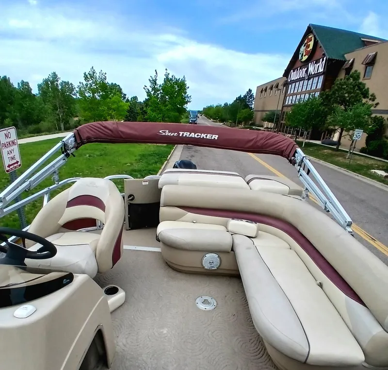 Slide: The Image of 2013 Sun Tracker Party Barge 22 DLX pontoon boat parked near Outdoor World store. - 4