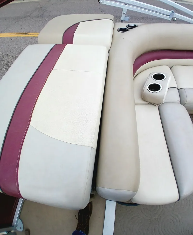 Slide: The Image of 2013 Sun Tracker Party Barge 22 DLX seating with cup holders, beige and maroon upholstery. - 5