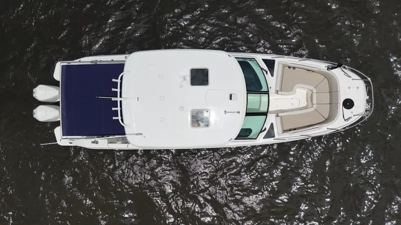 Slide: The Image of Overhead view of 2022 Boston Whaler 320 Vantage boat on water. - 10