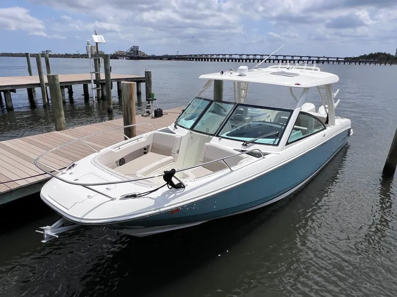 Slide: The Image of 2022 Boston Whaler 320 Vantage boat docked, featuring joystick control, 154 hours. - 13