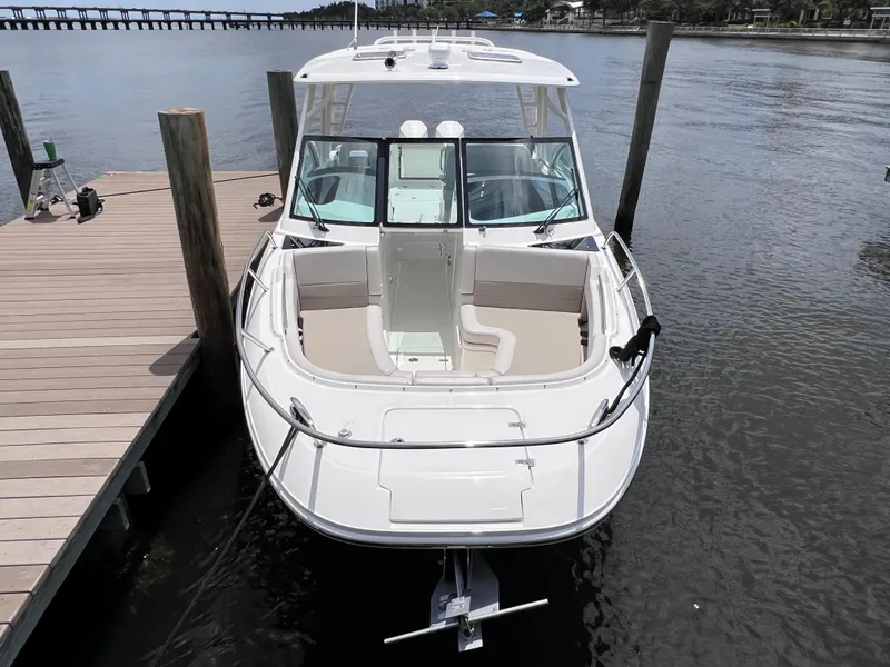 Slide: The Image of 2022 Boston Whaler 320 Vantage boat docked, front view, joystick control, 154 hours. - 14