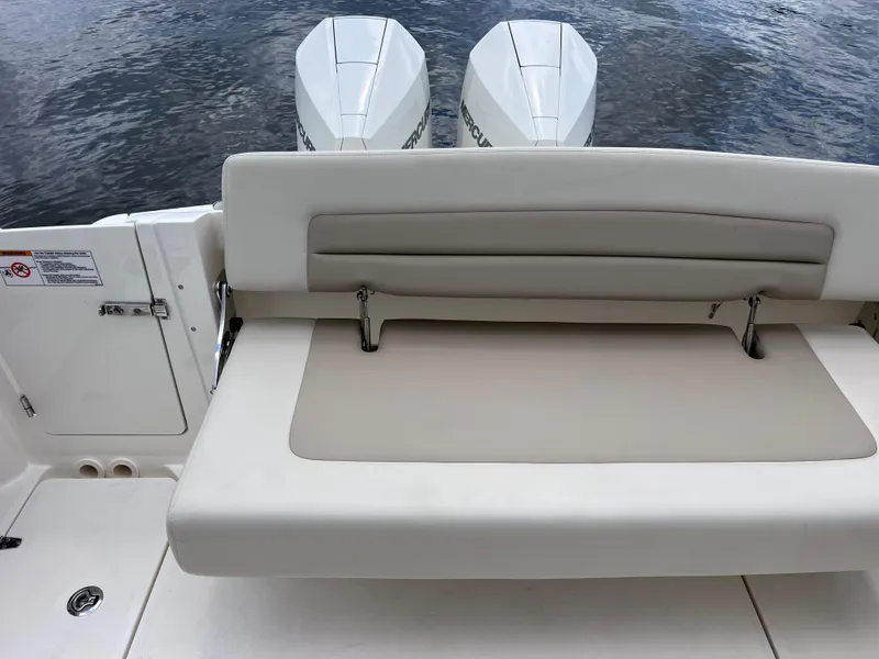 Slide: The Image of 2022 Boston Whaler 320 Vantage boat with dual engines and comfortable seating. - 21