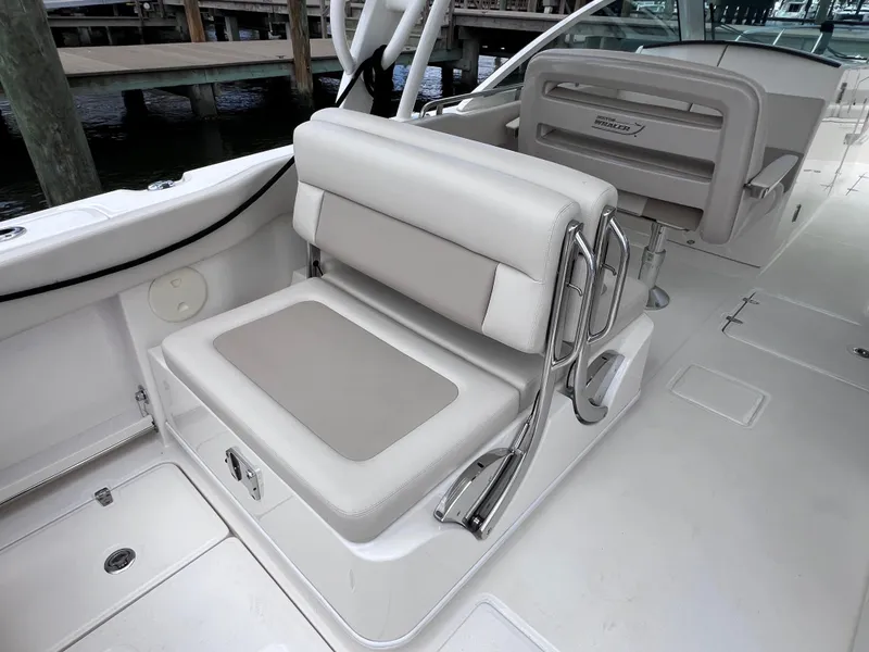 Slide: The Image of 2022 Boston Whaler 320 Vantage boat interior with comfortable seating and joystick controls. - 23