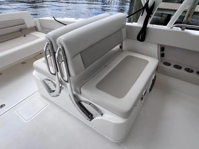 Slide: The Image of 2022 Boston Whaler 320 Vantage boat seating area with sleek, modern design and joystick control. - 24