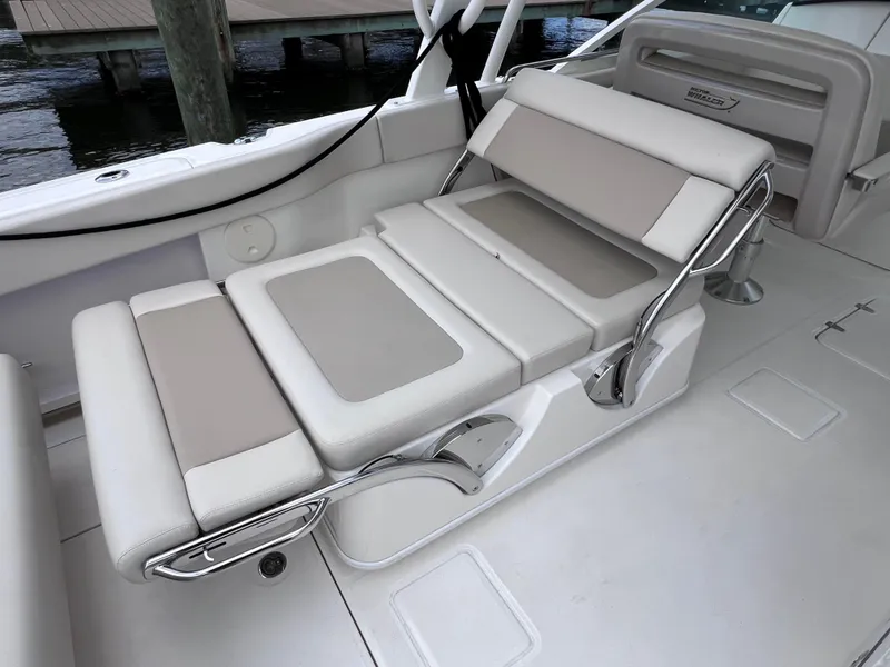 Slide: The Image of 2022 Boston Whaler 320 Vantage boat seating, adjustable and cushioned, with joystick control. - 25