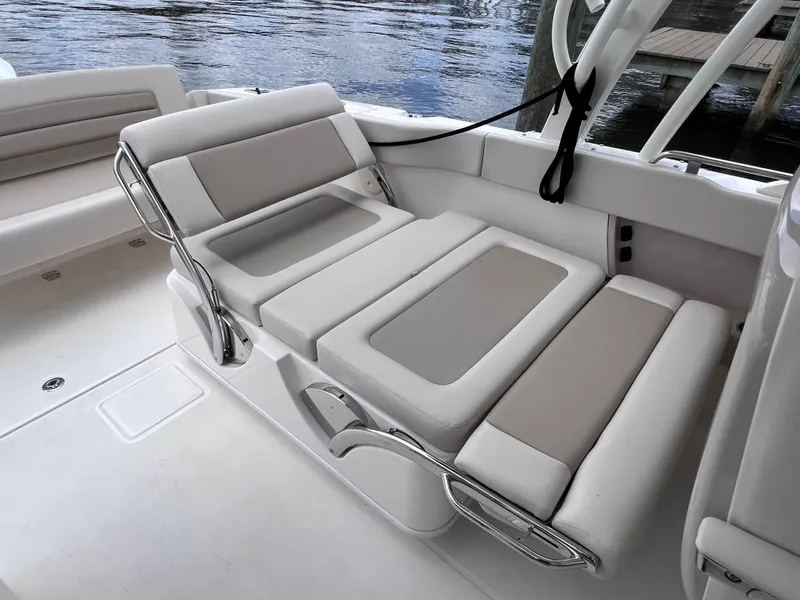 Slide: The Image of 2022 Boston Whaler 320 Vantage boat interior with comfortable seating and joystick control. - 27